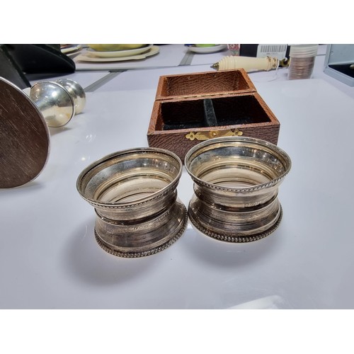 400 - A hallmarked silver candlestick along with a boxed hallmarked silver pair of serviette rings. Candle... 