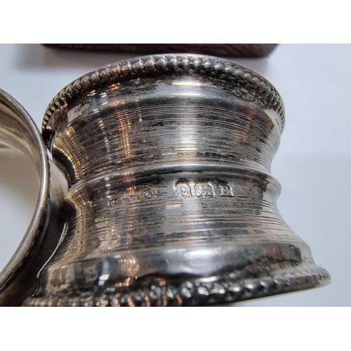 400 - A hallmarked silver candlestick along with a boxed hallmarked silver pair of serviette rings. Candle... 