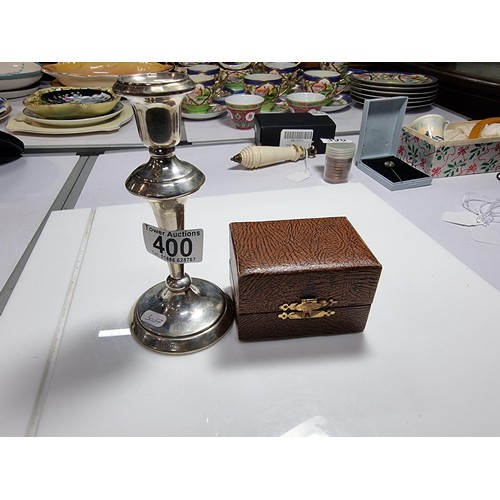 400 - A hallmarked silver candlestick along with a boxed hallmarked silver pair of serviette rings. Candle... 