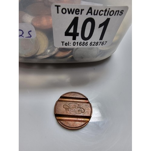 401 - A tub full of various world coins.