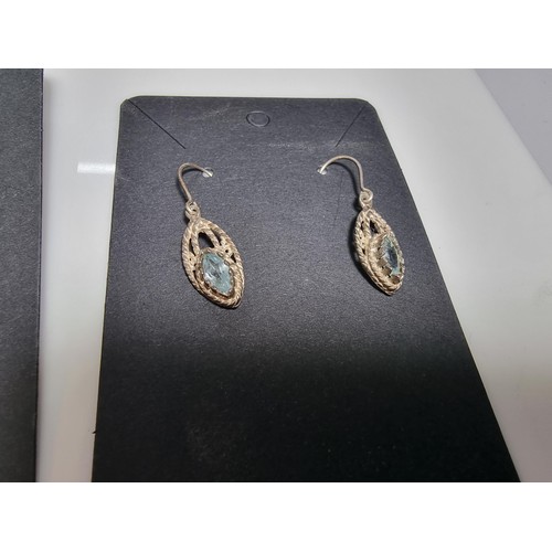 435 - A set of 12 pairs of costume earrings including some ornate pairs with m.o.p. gemstones etc.