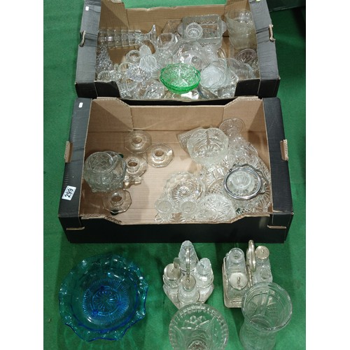 299 - 2 boxes containing a large quantity of collectable glassware including 2 cruet sets, sugar bowls, va... 