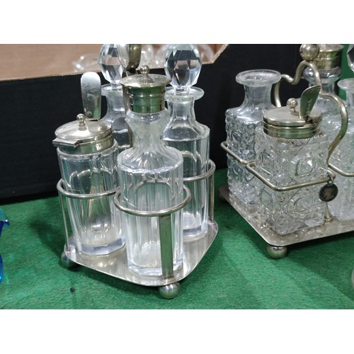 299 - 2 boxes containing a large quantity of collectable glassware including 2 cruet sets, sugar bowls, va... 