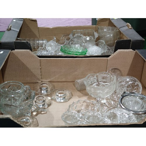 299 - 2 boxes containing a large quantity of collectable glassware including 2 cruet sets, sugar bowls, va... 