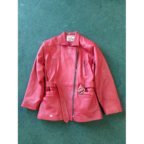 326A - A vintage red leather ladies jacket and mini skirt made by Zaghouani Cuir. In excellent condition, s... 