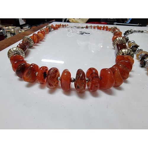 170A - 2x vintage hand made carnelian beaded necklaces one is inset with orange carnelian stones the other ... 