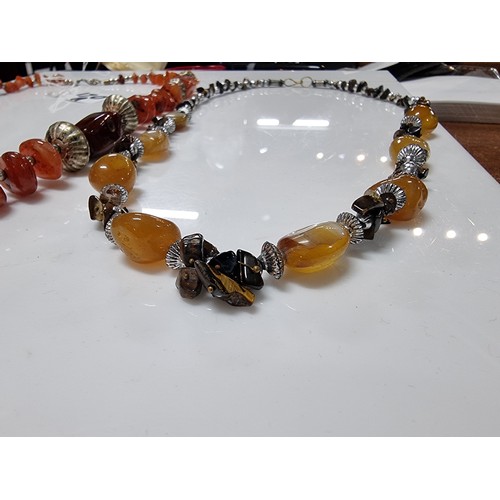 170A - 2x vintage hand made carnelian beaded necklaces one is inset with orange carnelian stones the other ... 