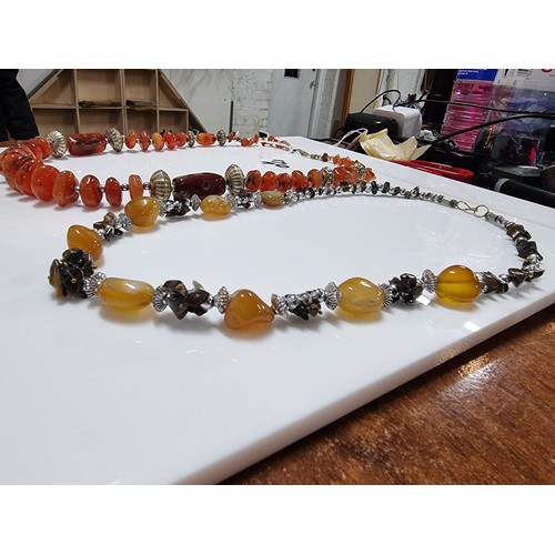 170A - 2x vintage hand made carnelian beaded necklaces one is inset with orange carnelian stones the other ... 