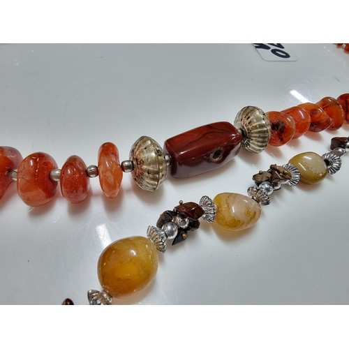 170A - 2x vintage hand made carnelian beaded necklaces one is inset with orange carnelian stones the other ... 