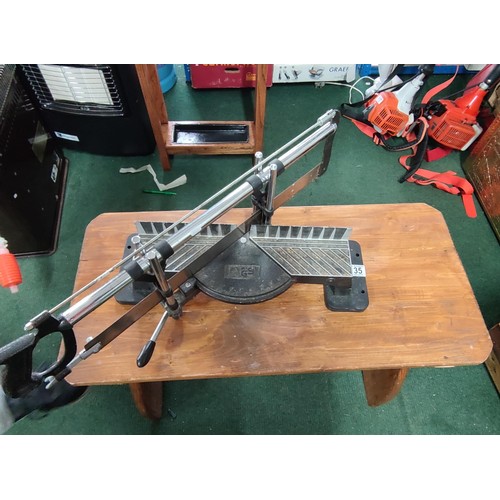 4 - A mitre saw and stand in good order.
Blade measures 52cm.