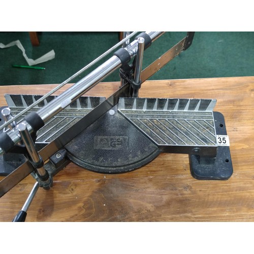 4 - A mitre saw and stand in good order.
Blade measures 52cm.