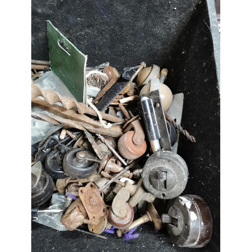 41 - Box containing a quantity of Bakelite light switches, vintage furniture castors, set square etc