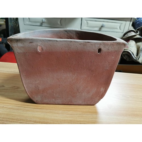 42 - Terracotta wall hanging planter with embossed decoration to the front  height 22cm, length 30cm dept... 