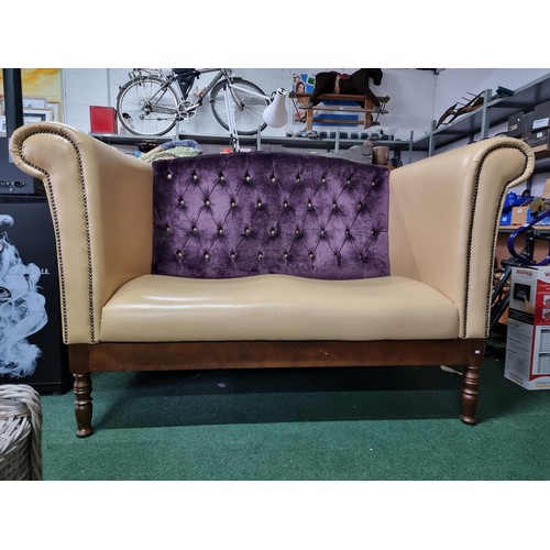 459 - Unusual cream leather deep arm sofa with studded fronts and a purple upholster button back in good c... 