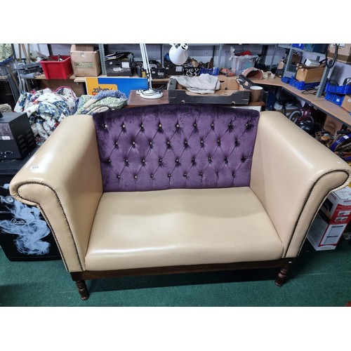 459 - Unusual cream leather deep arm sofa with studded fronts and a purple upholster button back in good c... 