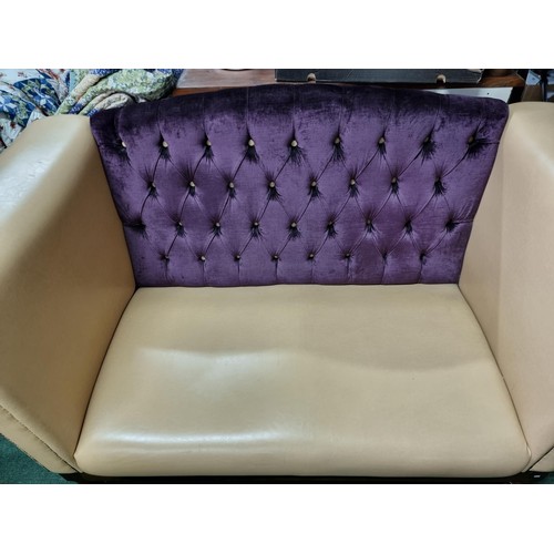 459 - Unusual cream leather deep arm sofa with studded fronts and a purple upholster button back in good c... 