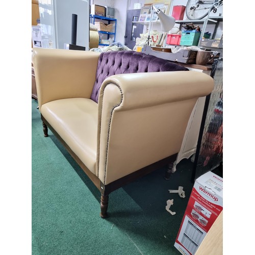 459 - Unusual cream leather deep arm sofa with studded fronts and a purple upholster button back in good c... 