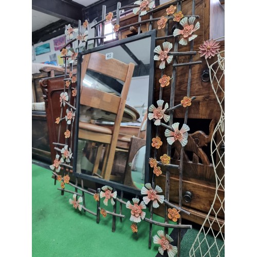 463 - Large iron work wall mirror with floral decoration along with a vintage metal dress formed hanger ra... 