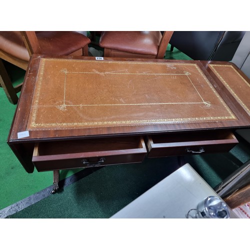 464 - Vintage leather topped mahogany coffee table with drop leaf ends complete with 2 drawers on ornate l... 