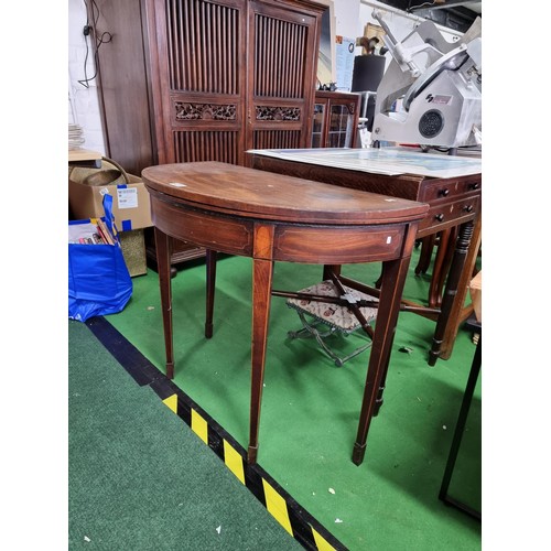 470 - Antique mahogany half moon table which folds out to be a circualr games table with a green baize wit... 