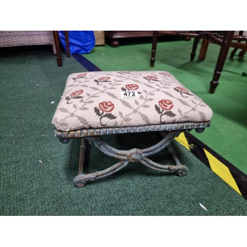 472 - Ornate antique footstool with a metal frame and an upholstererd top in good condition height 22cm le... 