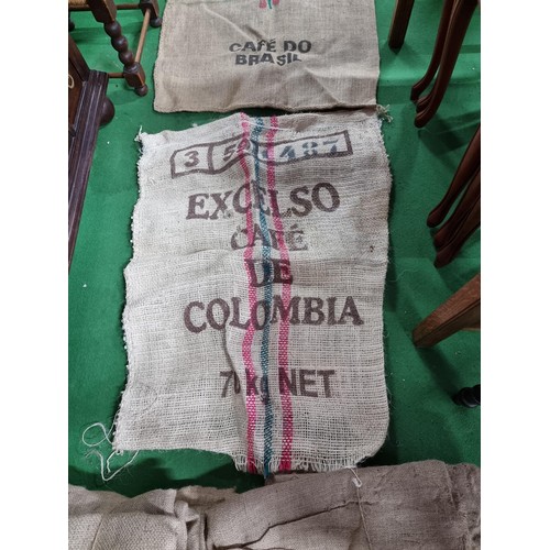 475 - Large quantity of vintage hessian sacks some include good advertising for Brazilian and Columbia cof... 