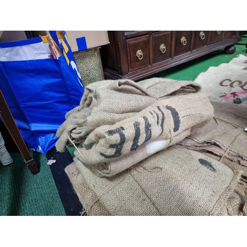 475 - Large quantity of vintage hessian sacks some include good advertising for Brazilian and Columbia cof... 