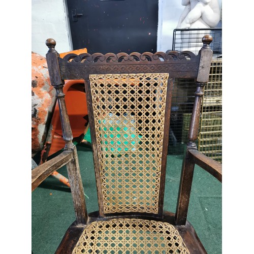 450 - Victorian inglenook chair with a professionally re woven cane back and seat back made of oak. in exc... 