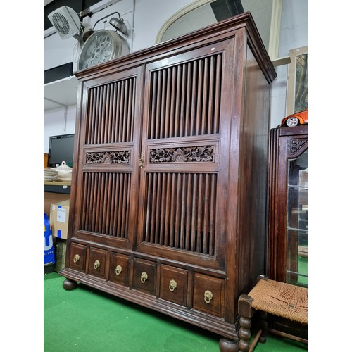 483 - Fine quality vintage Burmese solid teak wooded linen cupboard with two large doors with a rail / gri... 