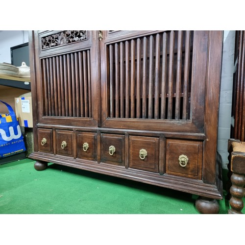 483 - Fine quality vintage Burmese solid teak wooded linen cupboard with two large doors with a rail / gri... 