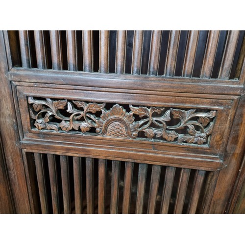 483 - Fine quality vintage Burmese solid teak wooded linen cupboard with two large doors with a rail / gri... 