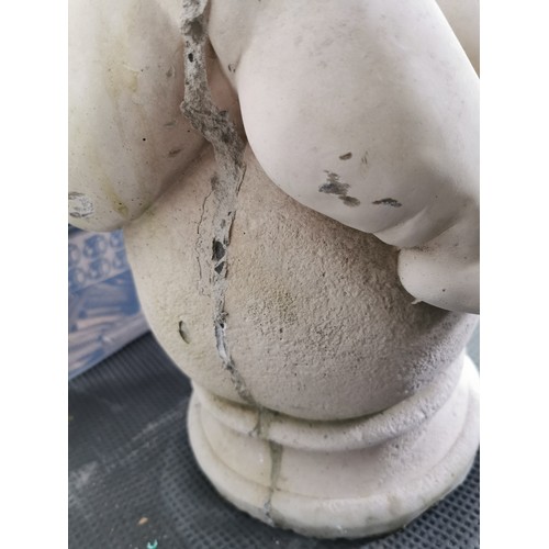 76 - Stunning vintage stoneware cherub seated on a baluster garden figure presenting excellent detail. in... 