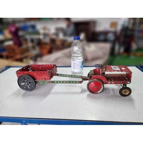 156 - An interesting early vintage Meccano tractor and trailer fully assembled, all with vintage parts and... 