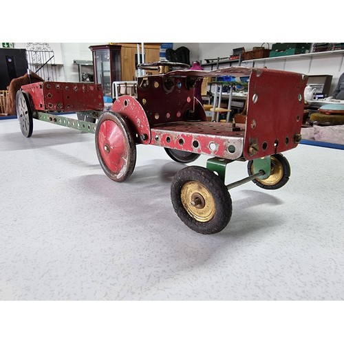 156 - An interesting early vintage Meccano tractor and trailer fully assembled, all with vintage parts and... 