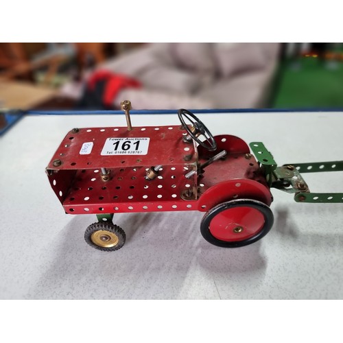 161 - An early vintage Meccano red tractor and trailer fully assembled all with original parts in good vin... 