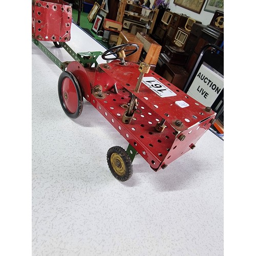 161 - An early vintage Meccano red tractor and trailer fully assembled all with original parts in good vin... 