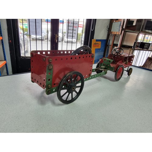 161 - An early vintage Meccano red tractor and trailer fully assembled all with original parts in good vin... 