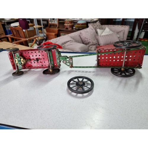 161 - An early vintage Meccano red tractor and trailer fully assembled all with original parts in good vin... 