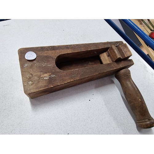 162 - An antique solid wood football clacker/rattle in good condition. Along with an antique handheld cata... 