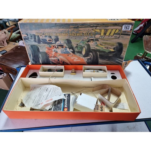 163 - A vintage club VIP raceway slot racing set, incomplete but to include 2 good collectable cars and a ... 