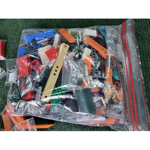 165 - A large collection of specialist Lego pieces 2.7kg in total. Including many new and sealed spare Leg... 