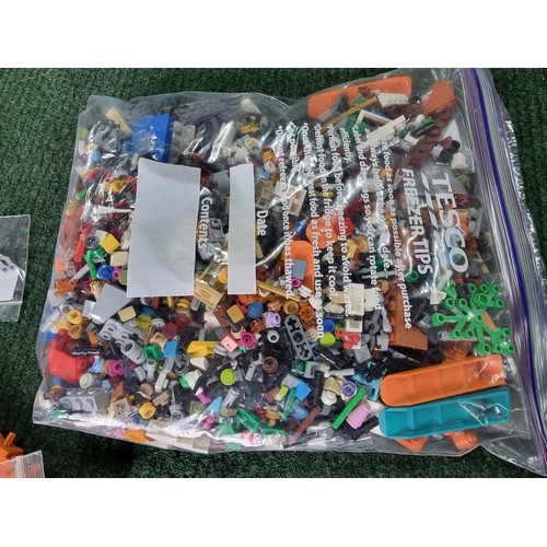 165 - A large collection of specialist Lego pieces 2.7kg in total. Including many new and sealed spare Leg... 