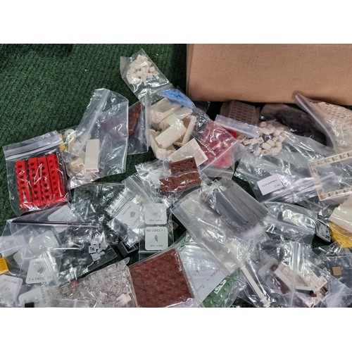 165 - A large collection of specialist Lego pieces 2.7kg in total. Including many new and sealed spare Leg... 