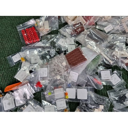 165 - A large collection of specialist Lego pieces 2.7kg in total. Including many new and sealed spare Leg... 