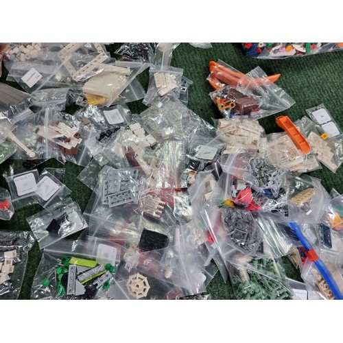 165 - A large collection of specialist Lego pieces 2.7kg in total. Including many new and sealed spare Leg... 