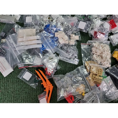 165 - A large collection of specialist Lego pieces 2.7kg in total. Including many new and sealed spare Leg... 