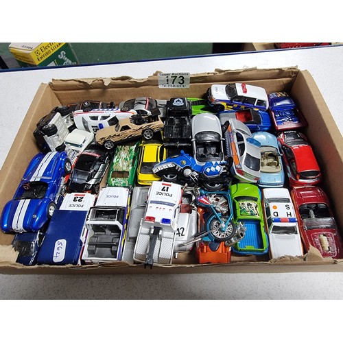 173 - A box containing a large quantity of vintage diecast cars including an early vintage police car whic... 