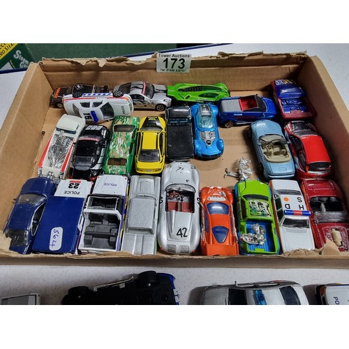 173 - A box containing a large quantity of vintage diecast cars including an early vintage police car whic... 