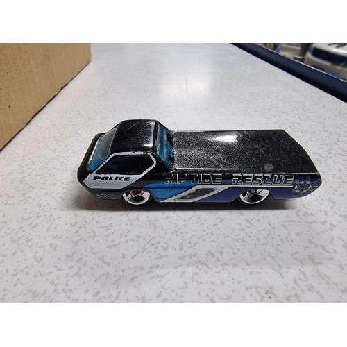 173 - A box containing a large quantity of vintage diecast cars including an early vintage police car whic... 