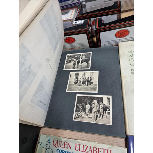 238 - A large collection of Royal memorabilia books including coronation books for King George V, Edward V... 